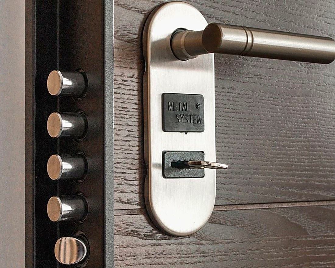 Close view of a multipoint door mechanism and handle, the kind of existing hardware a survey has to account for.